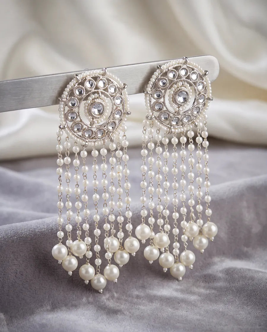 Silver-tone kundan earrings with pearl tassels