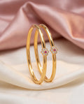 Slim bangles with a flower stone