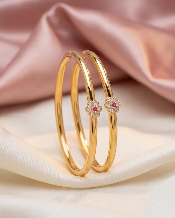 Slim bangles with a flower stone